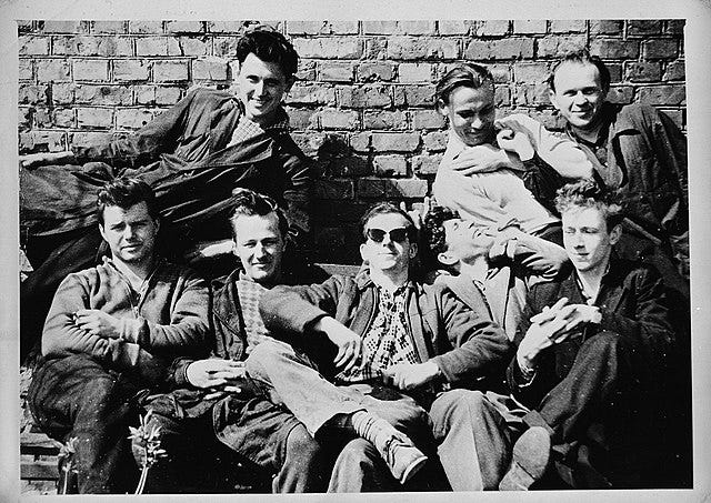 Oswald with Fellow Workers at the Television Factory, Source: Wikicommons