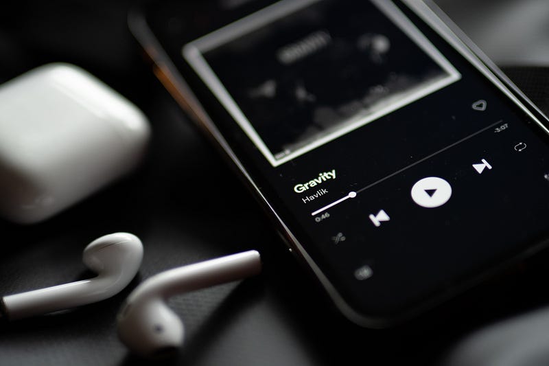 A person listening to music on their smartphone