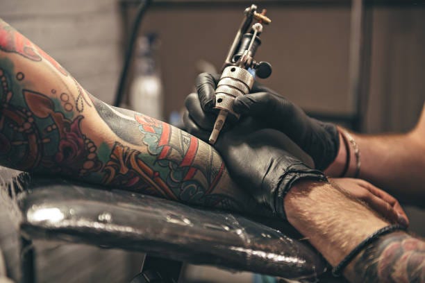 Tattoo artist preparing sterile equipment