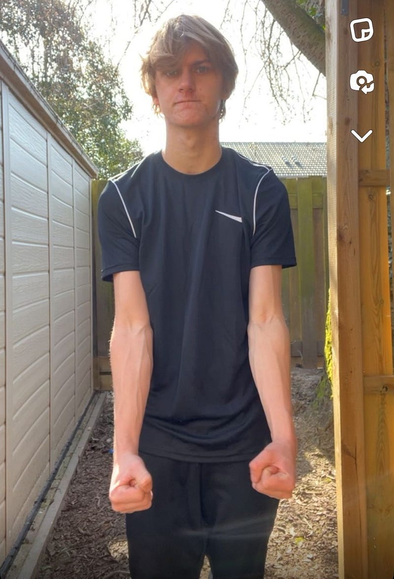 Young man flexing muscles before turning 18