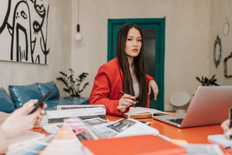 A woman organizing her writing strategy at her desk