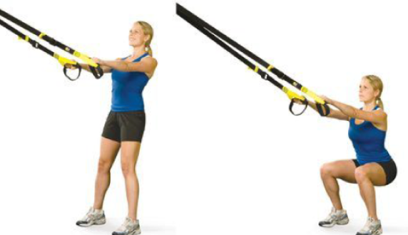 Demonstrating a TRX squat