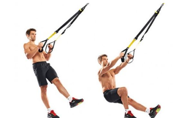 Performing a pistol squat using TRX