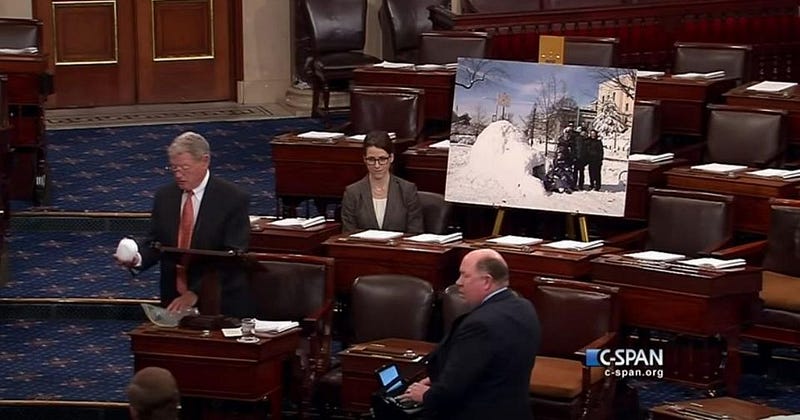 Senator James Inhofe presenting a snowball as evidence against climate change.